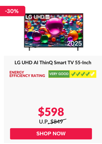 Man in a gray blazer over a dark gray shirt standing on stairs in an urban background.