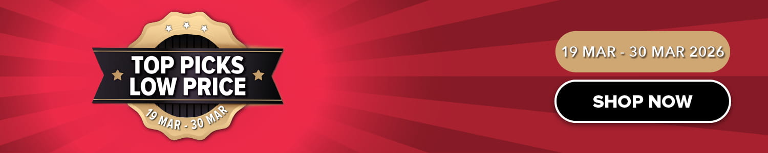 Three women enjoying a shopping day, carrying multiple colorful shopping bags while walking together outdoors.