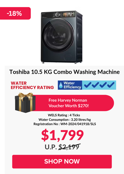 Woman wearing an olive green blazer and light blue jeans walking in an urban setting.