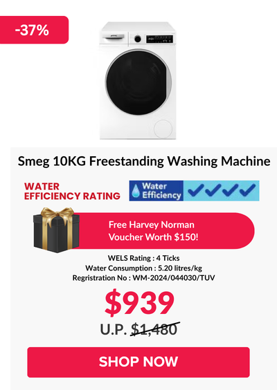 Woman wearing an olive green blazer and light blue jeans walking in an urban setting.