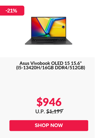 Man in a gray blazer over a dark gray shirt standing on stairs in an urban background.