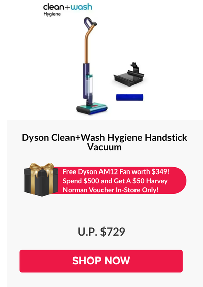 Woman wearing an olive green blazer and light blue jeans walking in an urban setting.