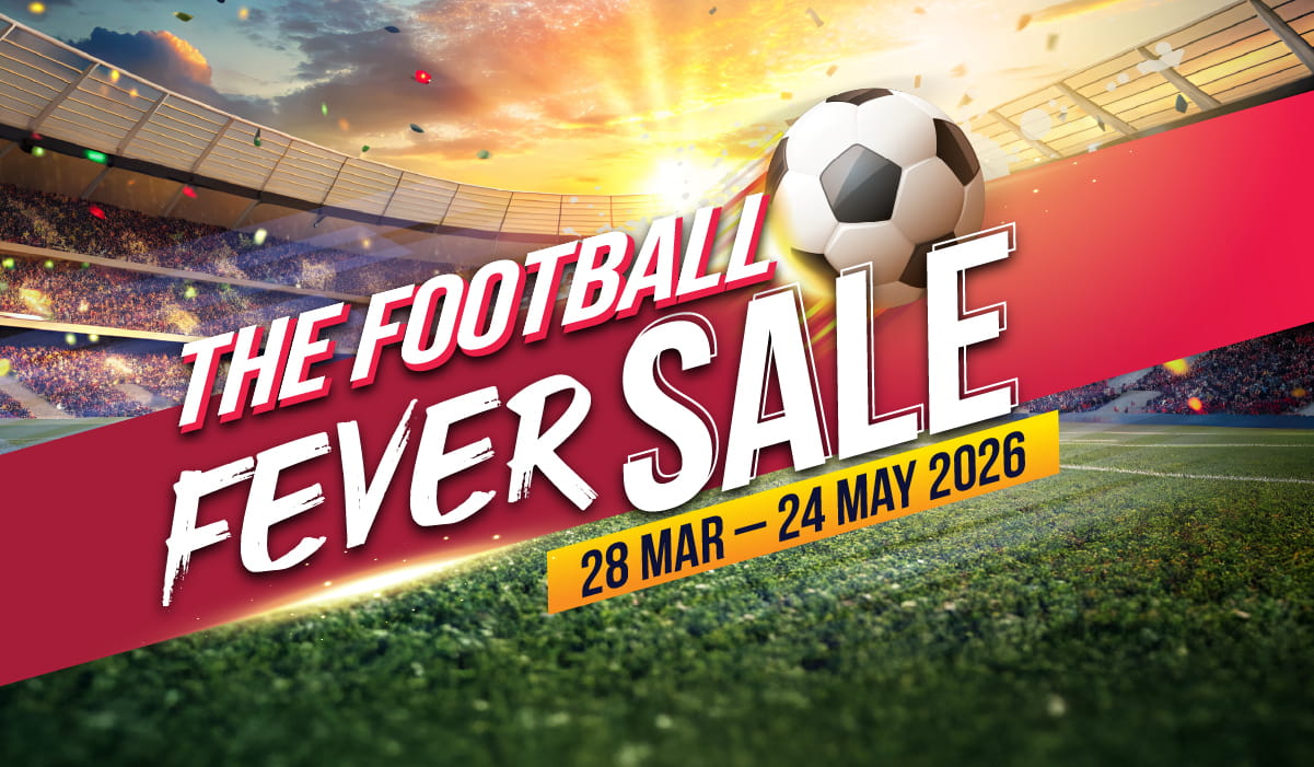 Three women enjoying a shopping day, carrying multiple colorful shopping bags while walking together outdoors.