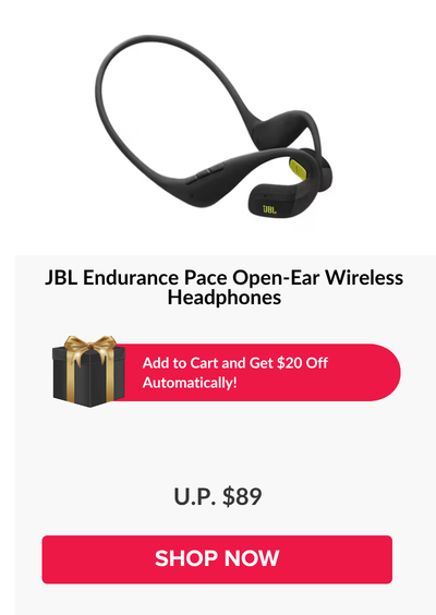 Woman wearing an olive green blazer and light blue jeans walking in an urban setting.