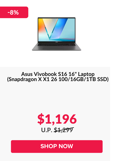 Man in a gray blazer over a dark gray shirt standing on stairs in an urban background.