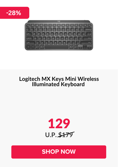 Woman wearing an olive green blazer and light blue jeans walking in an urban setting.