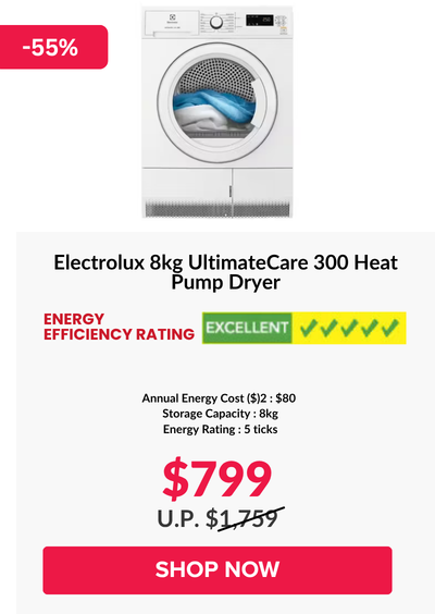 Woman wearing an olive green blazer and light blue jeans walking in an urban setting.