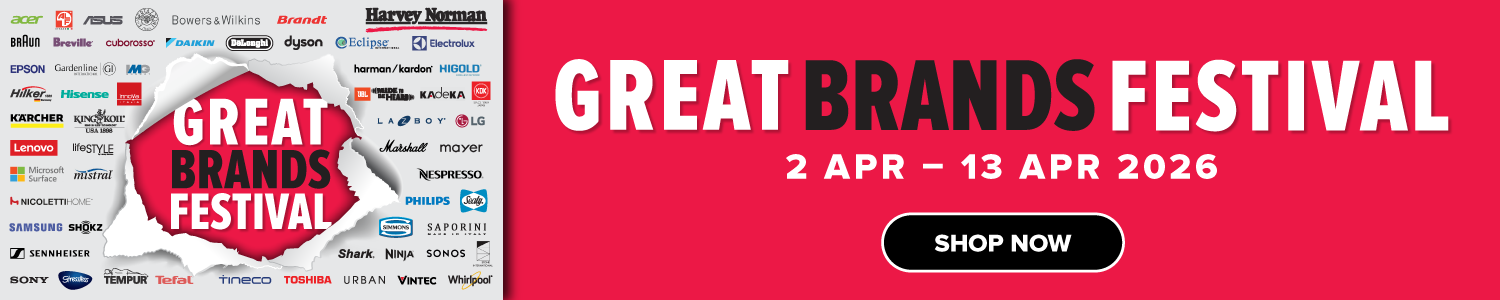 Three women enjoying a shopping day, carrying multiple colorful shopping bags while walking together outdoors.