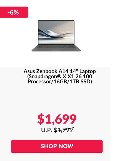 Man in a gray blazer over a dark gray shirt standing on stairs in an urban background.