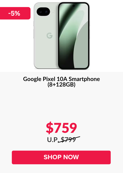 Man in a gray blazer over a dark gray shirt standing on stairs in an urban background.