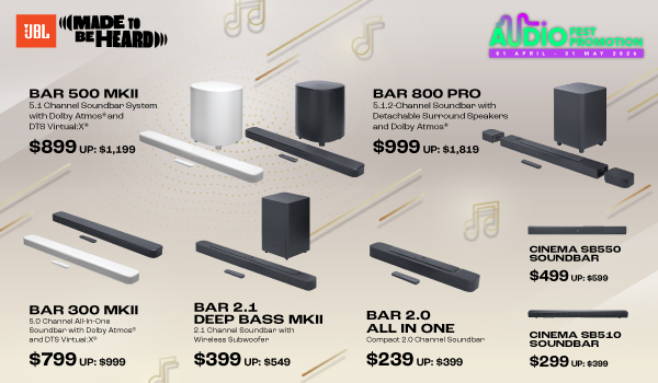 Woman wearing an olive green blazer and light blue jeans walking in an urban setting.