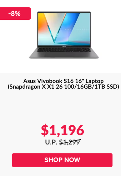 Man in a gray blazer over a dark gray shirt standing on stairs in an urban background.