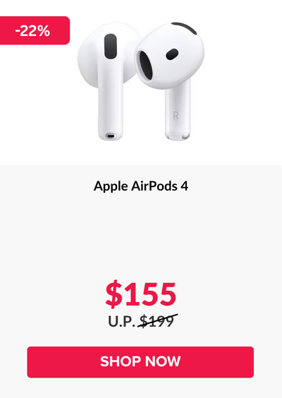 Woman wearing an olive green blazer and light blue jeans walking in an urban setting.