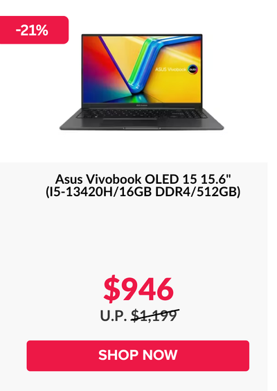 Man in a gray blazer over a dark gray shirt standing on stairs in an urban background.