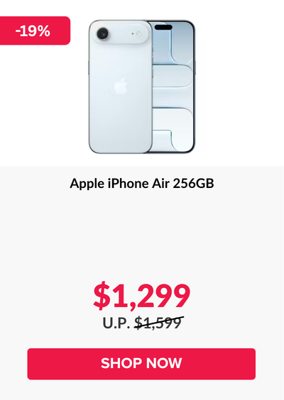 Woman wearing an olive green blazer and light blue jeans walking in an urban setting.