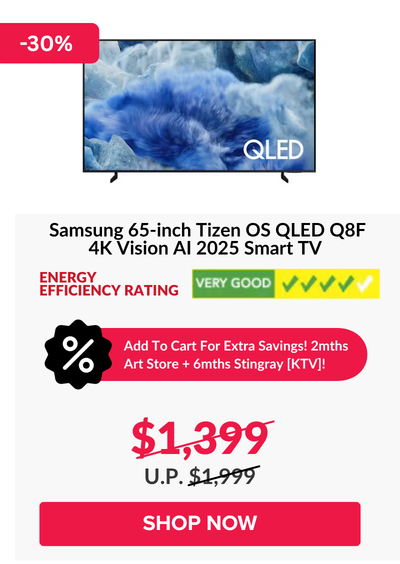 Man in a gray blazer over a dark gray shirt standing on stairs in an urban background.