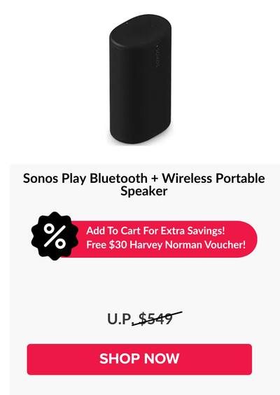 Woman wearing an olive green blazer and light blue jeans walking in an urban setting.