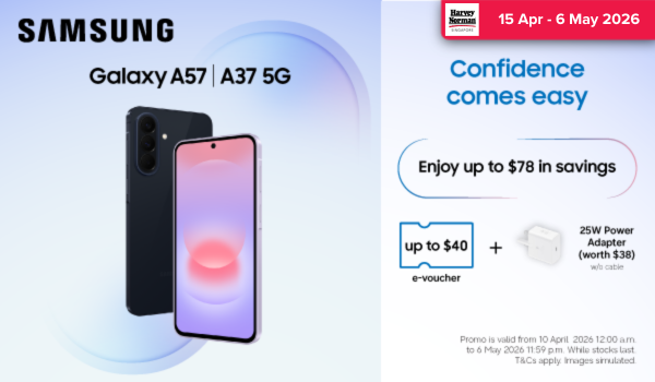 Woman wearing an olive green blazer and light blue jeans walking in an urban setting.