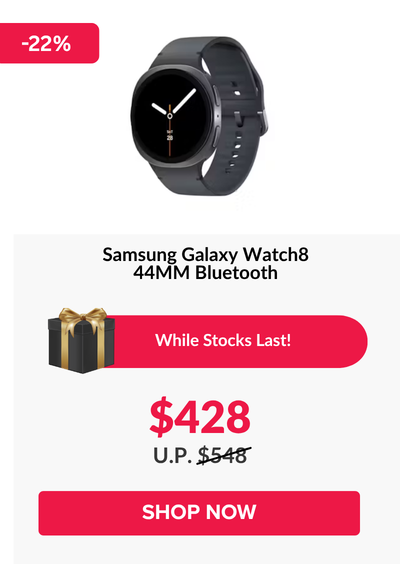 Woman wearing an olive green blazer and light blue jeans walking in an urban setting.