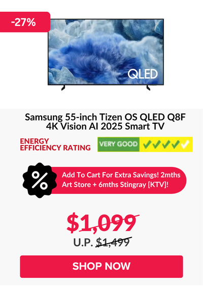 Man in a gray blazer over a dark gray shirt standing on stairs in an urban background.