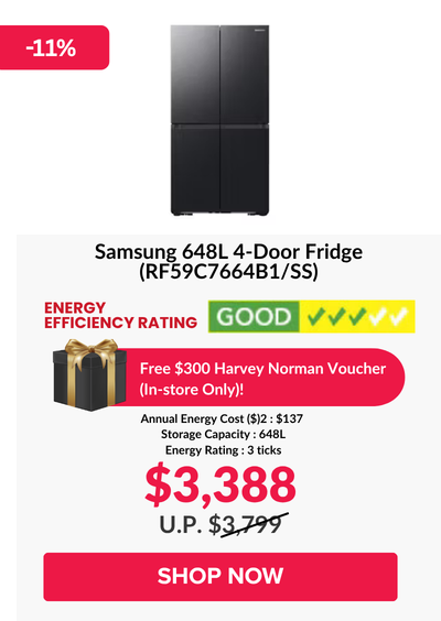 Woman wearing an olive green blazer and light blue jeans walking in an urban setting.