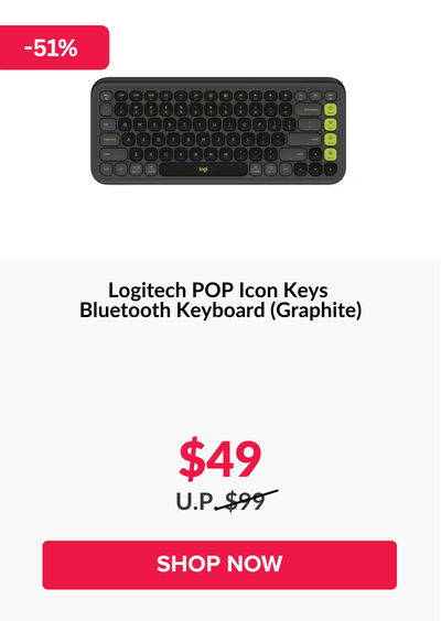 Woman wearing an olive green blazer and light blue jeans walking in an urban setting.