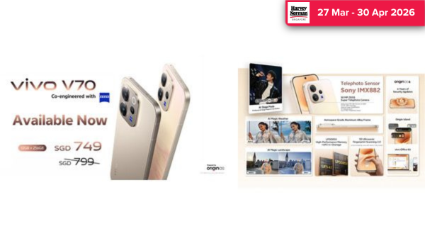 Man in a gray blazer over a dark gray shirt standing on stairs in an urban background.