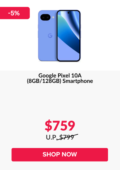 Man in a gray blazer over a dark gray shirt standing on stairs in an urban background.