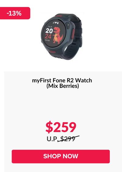 Woman wearing an olive green blazer and light blue jeans walking in an urban setting.