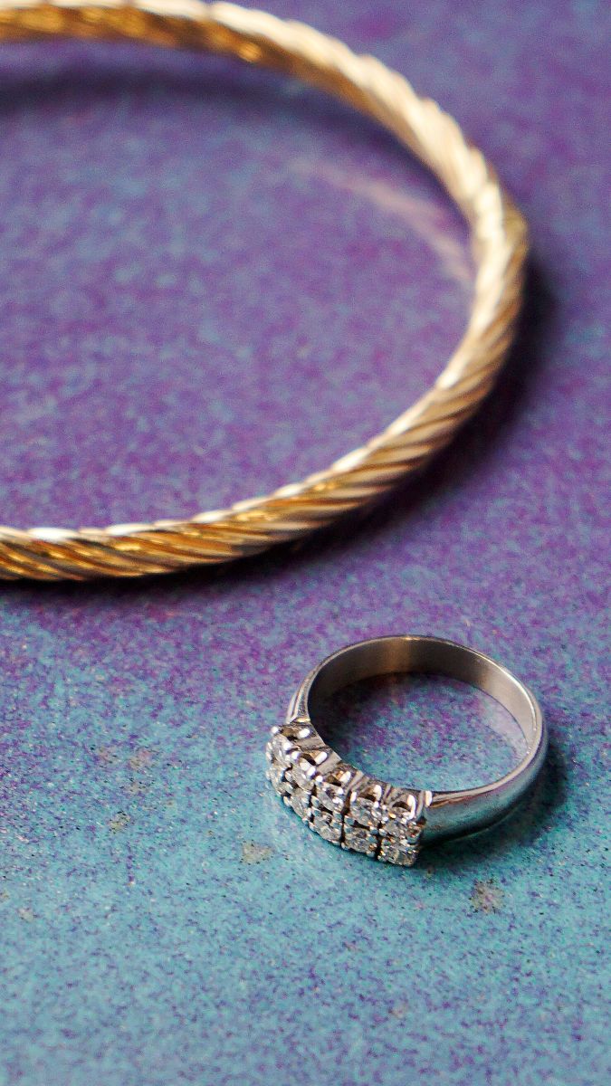 Golden bracelet and silver ring with diamonds