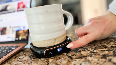 a person using a coffee cup on a digital weigh scaleCoffee Mug Warmer Just $9.99 Shipped for Amazon Prime Members (Reg. $23)