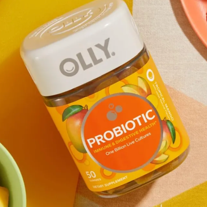 A container of OLLY probiotic gummies on a table