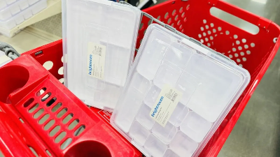 White ands clear storage boxes with smaller internal organizer containers