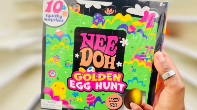 Hand Holding a Nee-Doh box set with Easter designs on the cover 