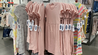 Rack of dresses and romers at Old Navy