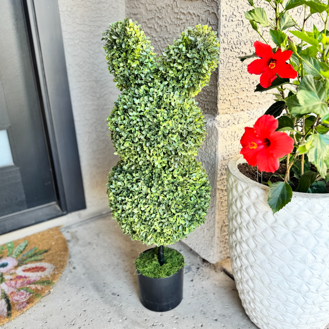 Bunny shaped topiary bush with a pot 