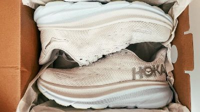 white hoka shoes in a box