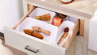 open drawer with organizing divider bins inside