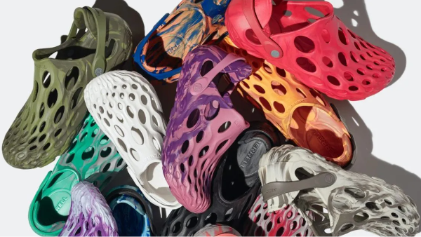 Pile of water friendly shoes in a variety of colors