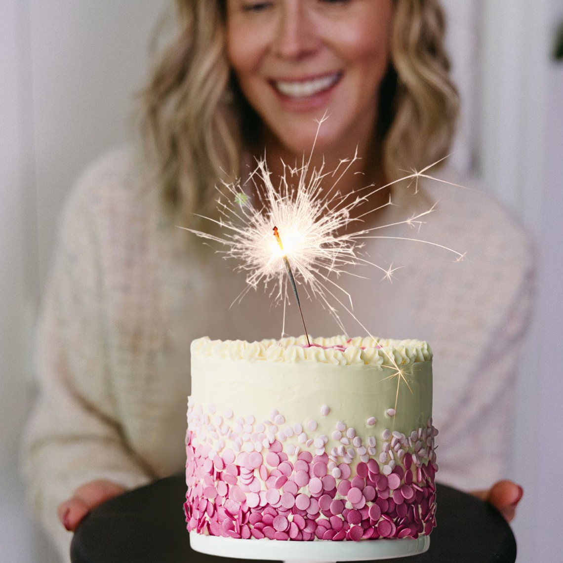 woman looking at cake