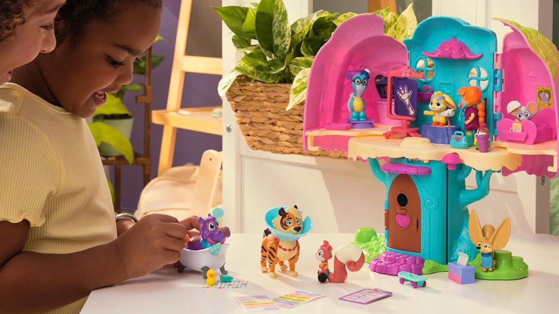 child playing with an animal dollhouse playset