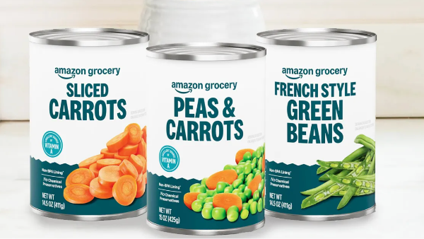 three cans of sliced carrots peas and carrots and french style green beans on a table