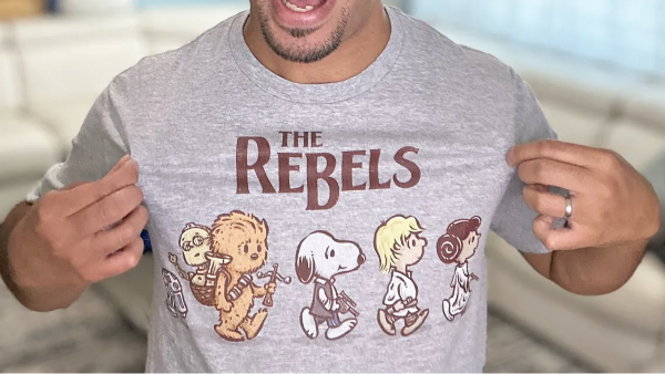 man wearing a grey graphic tee with snoopy
