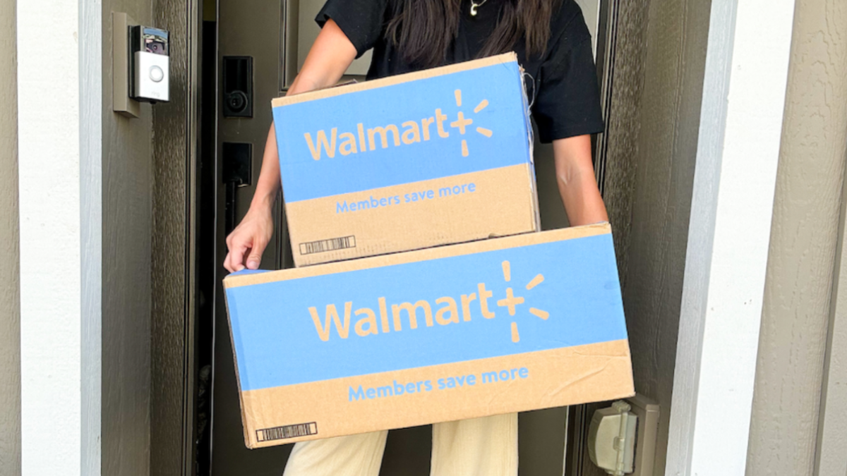 woman holding walmart boxes