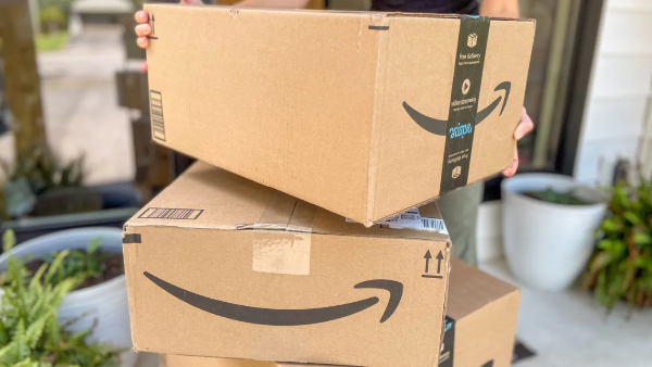 Two amazon boxes on top of eachother on a porch