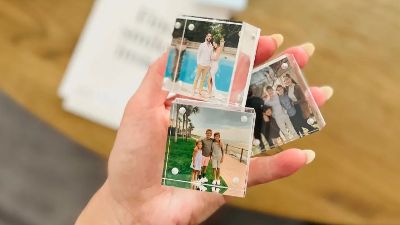 hand holding walgreens photo tiles