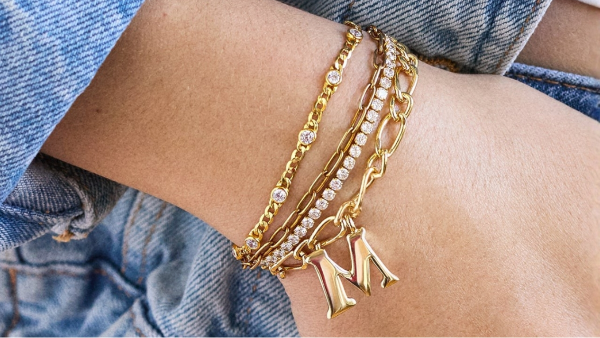 wrist with gold bracelets