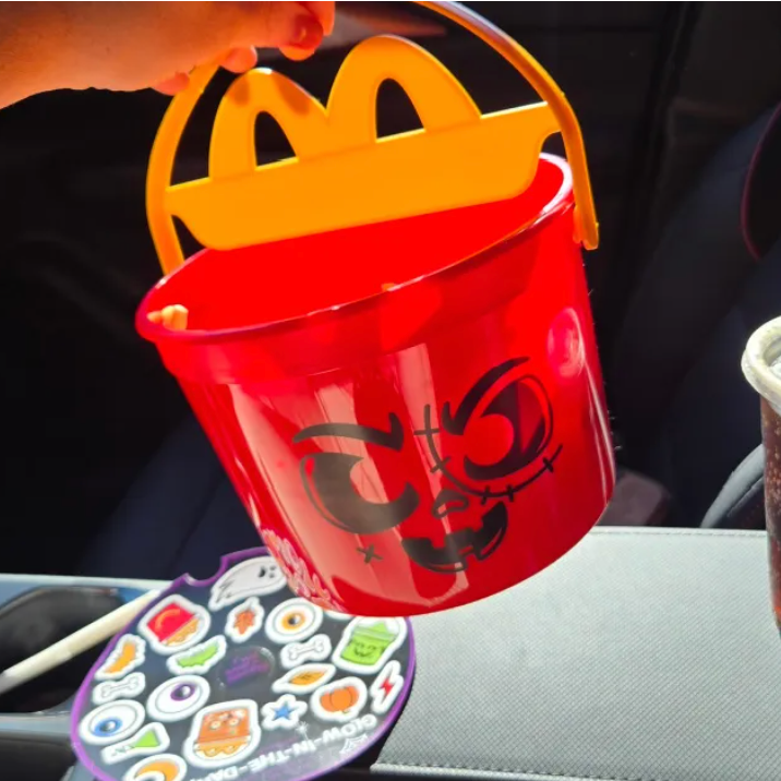 a cardboard box filled with bags and bags of equipment