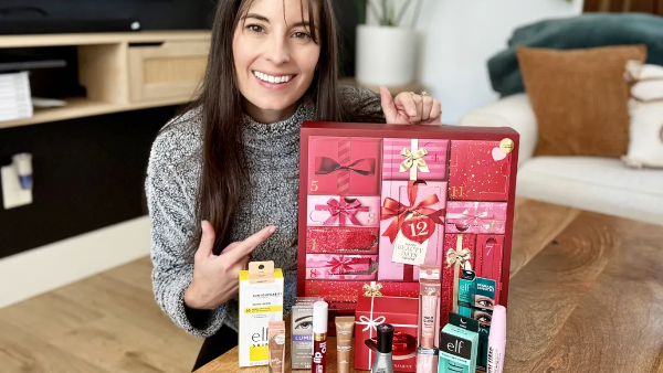 woman holding a beauty advent calendar