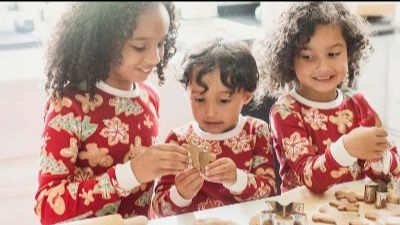 3 kids wearing matching pajamas